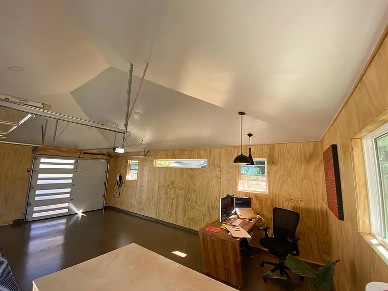 Garage with polished concrete, full spray on insulation and heating