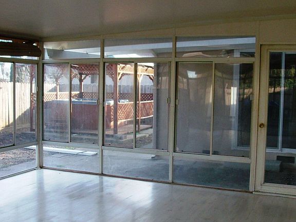 View from Bonus/Sun Room to Hot Tub/Gazebo & yard