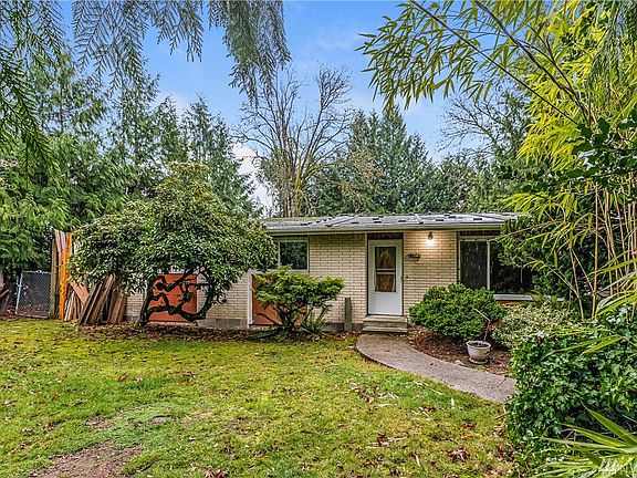 Quiet & Secluded Lot Surrounded by Towering Evergreens, Trees, Shrubbery & Bushes ready to be Personalized.
