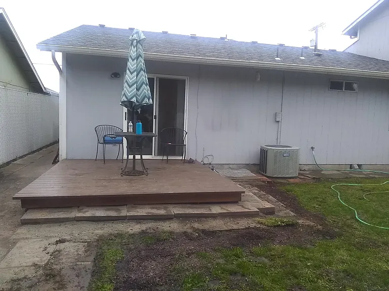 Deck from Master Bedroom leading to yard. Second yard entry to the left of photo.