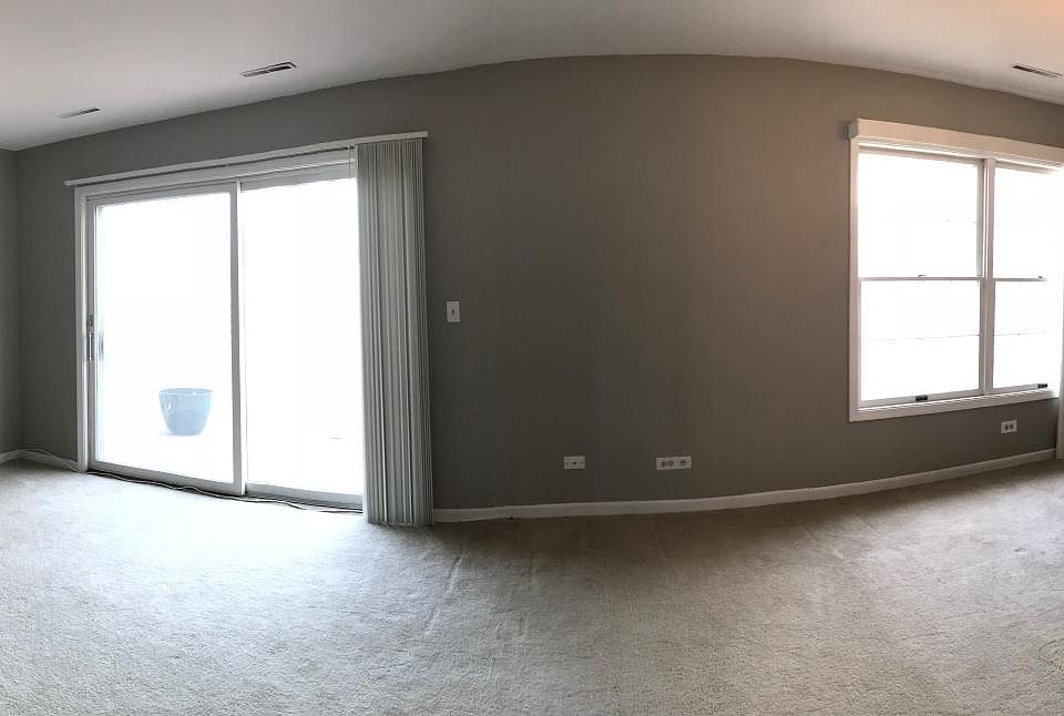 Panoramic from the entry door in to the living room and the 