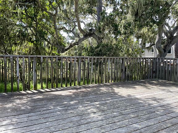 Large back deck with access to the back yard.
