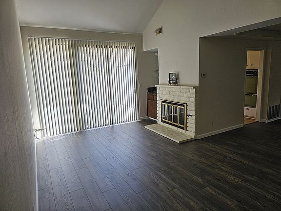 living room w/ fireplace and wet bar