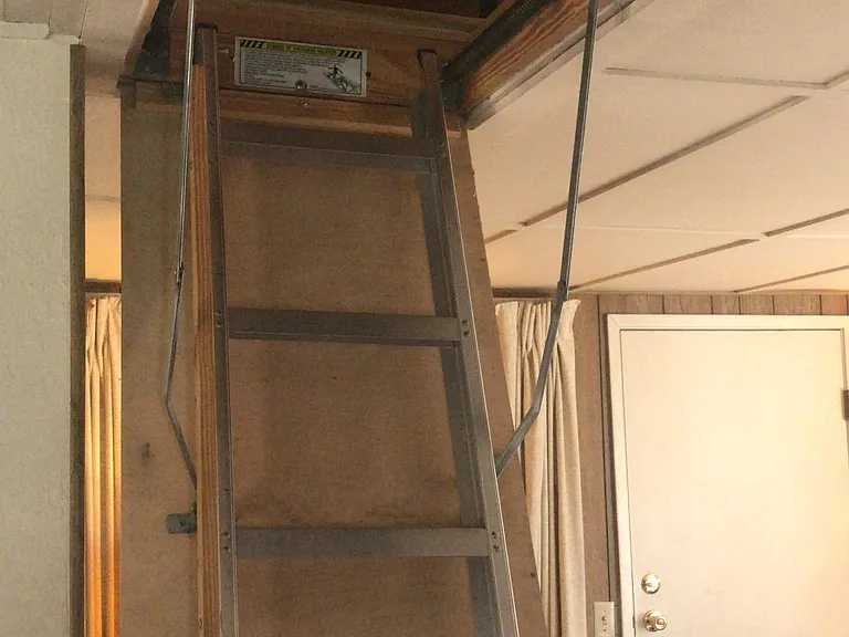 Drop down stairs to attic. 3 beds for occasional guest.