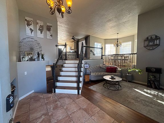 From front entry way. Split level, stairs going down to basement or up to kitchen and other bedrooms/bathroom.