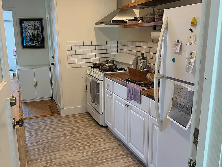 New kitchen upgrades with new lighting floating shelves, floor and more.