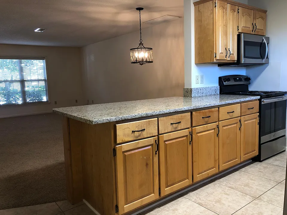 Pocelan tile in kitchen and bathrooms. 
Contempory light fixtures.