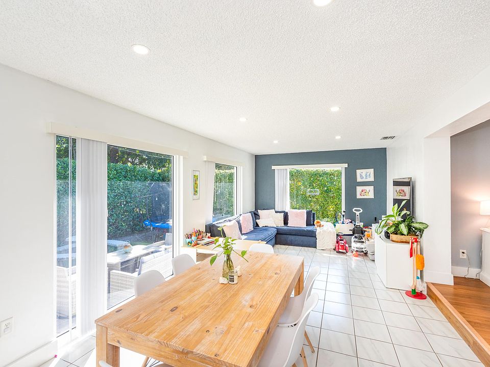 family room with hurricane windows floor to ceiling