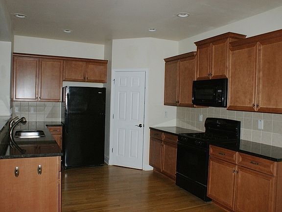 Beautiful Kitchen with Granite Counters, Hardwood Floors, an