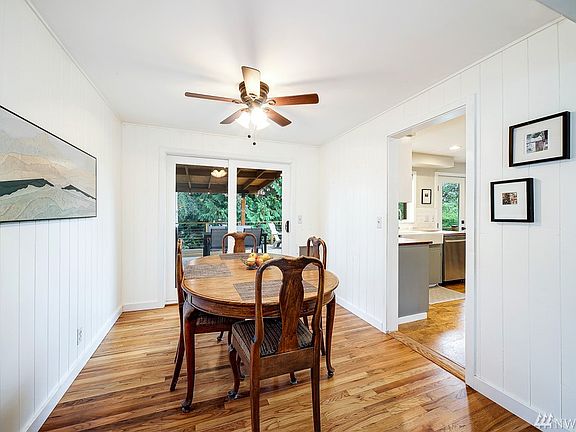 There's plenty of space in the dining room for large gatherings!  The sliding door leads to the amazing, partially covered deck for year-round outdoor entertaining!