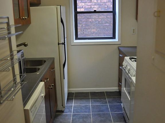 Galley kitchen with small pass-thru to dining room