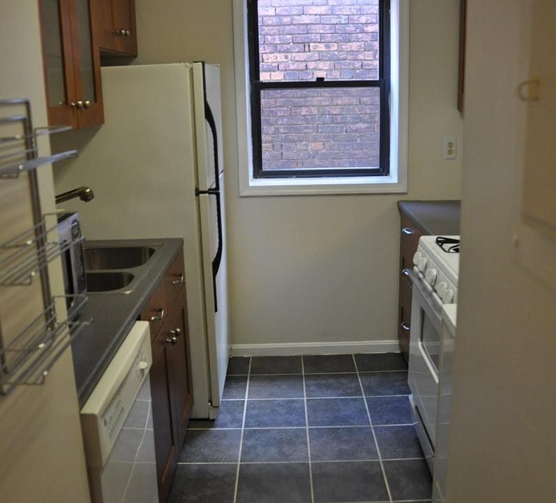 Galley kitchen with small pass-thru to dining room