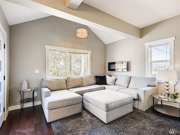 Inviting living room adorned with vaulted ceiling.