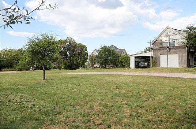 Front Driveway and view of garage apt , parsonage, RV cover