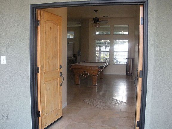 Enter the spacious parlor complete with travertine flooring