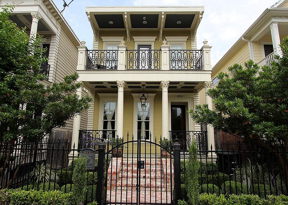 New Orleans styled architecture with exquisite trim, wrought iron gates, and gas lamp imported from 