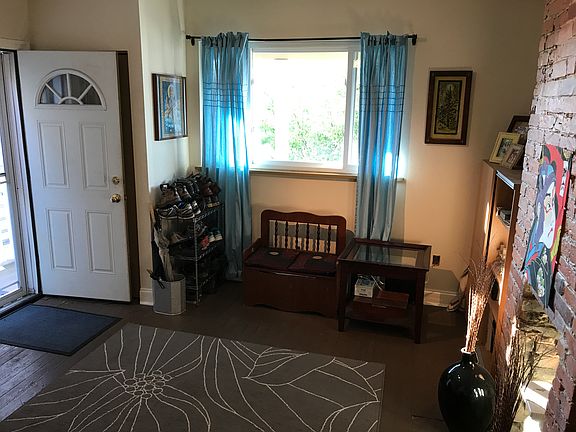 Living room with front door on the left