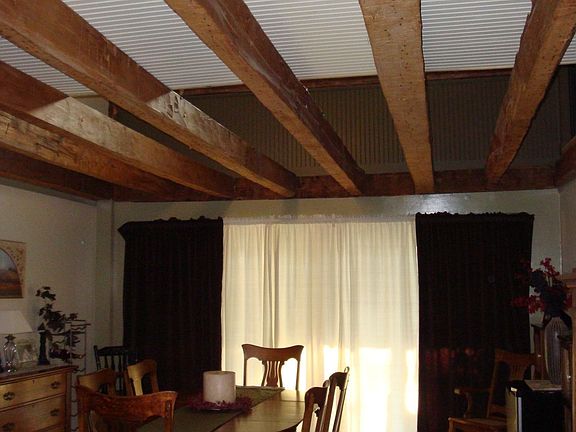 Dining room with beams - walkway above
