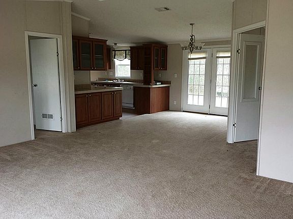living room is open to formal dining room & kitchen