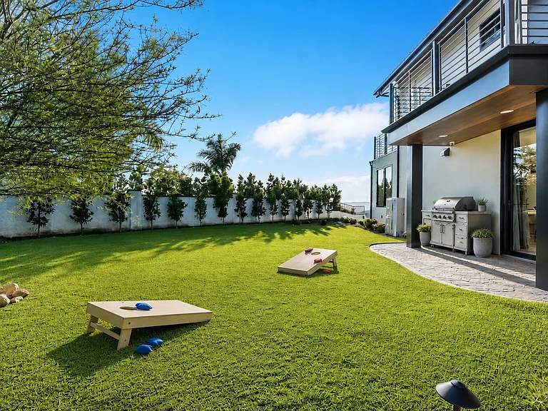 This artificial turf area is directly outside the kitchen and below the balcony from the 2nd floor bathroom. This is actually a great are for picnics or pets.