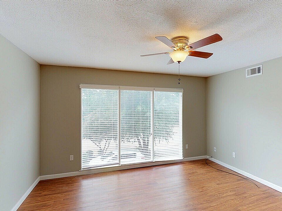 Experience natural light and comfort in this airy living room.