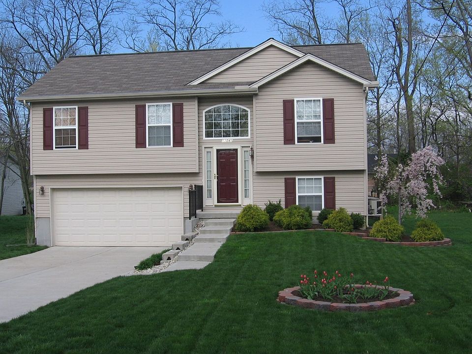 Front of the house showing garden area and custom landscaping.