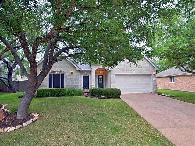 This well maintained home is found in the private golf course community of the Onion Creek Subdivisi