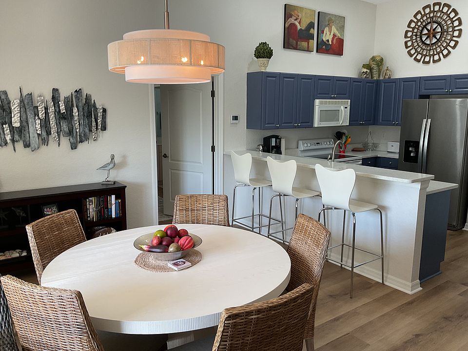 Open concept living space with table and chairs for 6 and counter space for three more!
