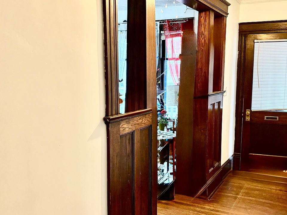 Old photo but shows the entrance way. Freshly painted before September 1 and the room to the left is the living room. There is room for a coat hanger, table/shelf, etc.
