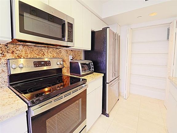 5th image of 3500 Mystic Pointe Dr APT 701