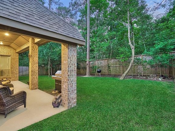 Covered Patio with canned lighting off of the Family Room is perfect for Grilling and Entertaining.
