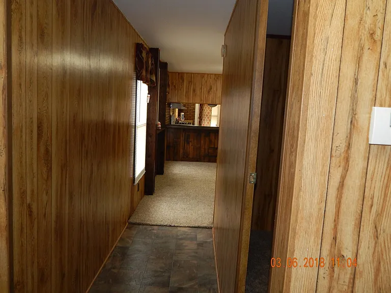 Taken from rear bedroom - looking to living room .