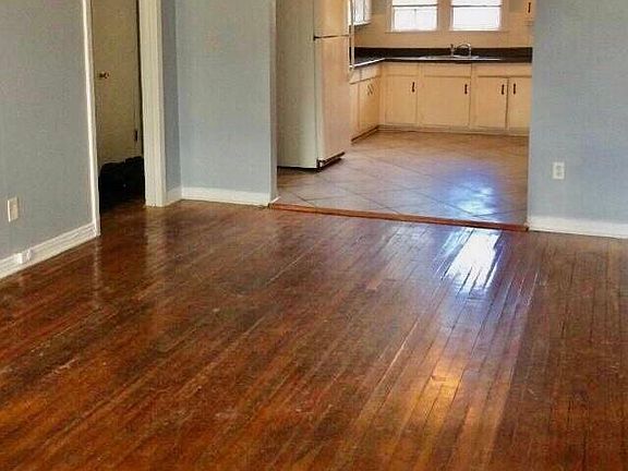 Lots of character. Archway from living room to kitchen