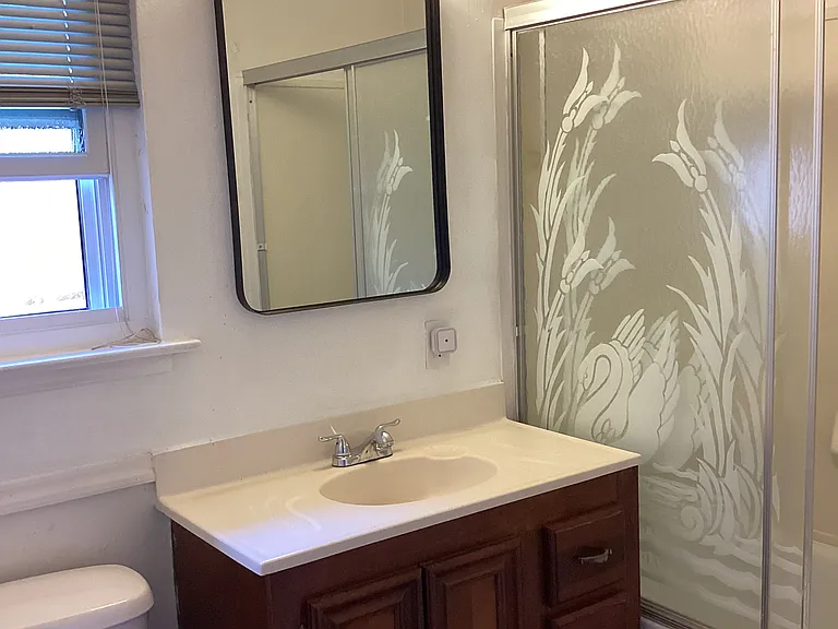 Second bathroom with shower and tub.