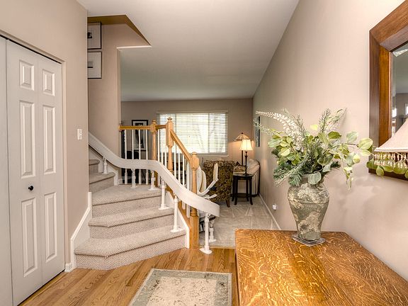 Elegant Foyer Entrance With Hardwood Flooring