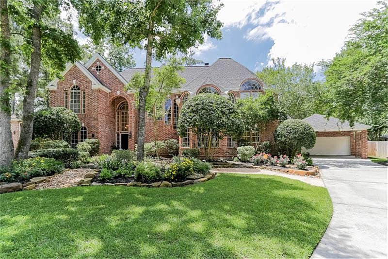 This beautiful home sits at the end of a cul-de-sac on a large lot with artful landscaping. You will