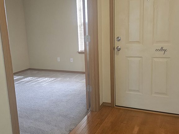 Double doors lead to office space off of entry