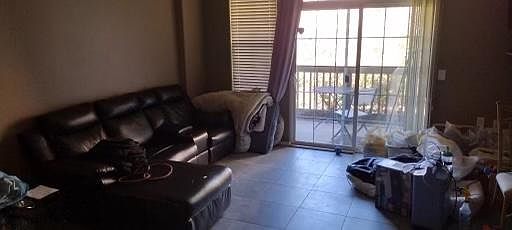The living room with balcony. We get enough sun to warm the balcony, but enough shade to keep the condo cool on hot days.