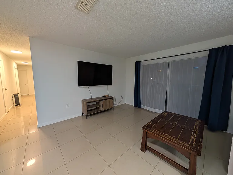 Living room; hallway to the left