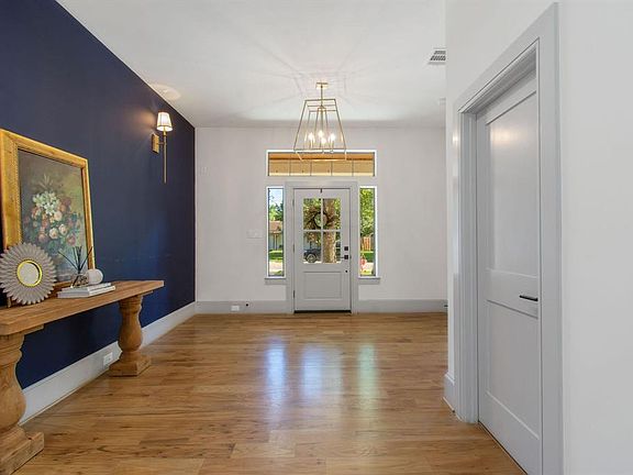 Accent paint adds a pop of color to this neutral space! Full bath to the right.