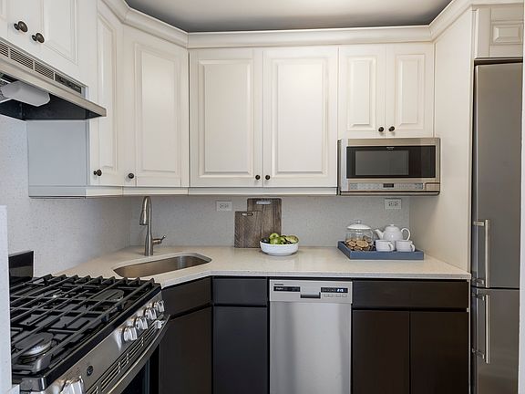 Renovated kitchens with stainless steel appliances and quartz countertops