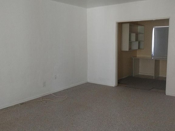 Huge living room with view of office with built ins