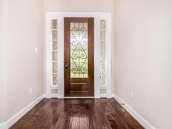 Pristine Wood Floors throughout Entry, Study, Formal Dining, and Family Room.