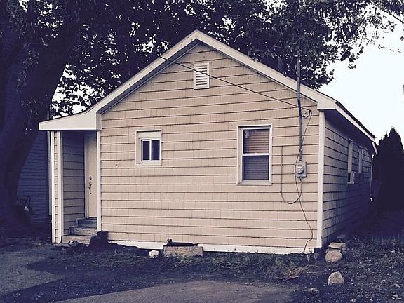 Front of home. Bathroom window is the smaller window, and second bedroom is the larger window.