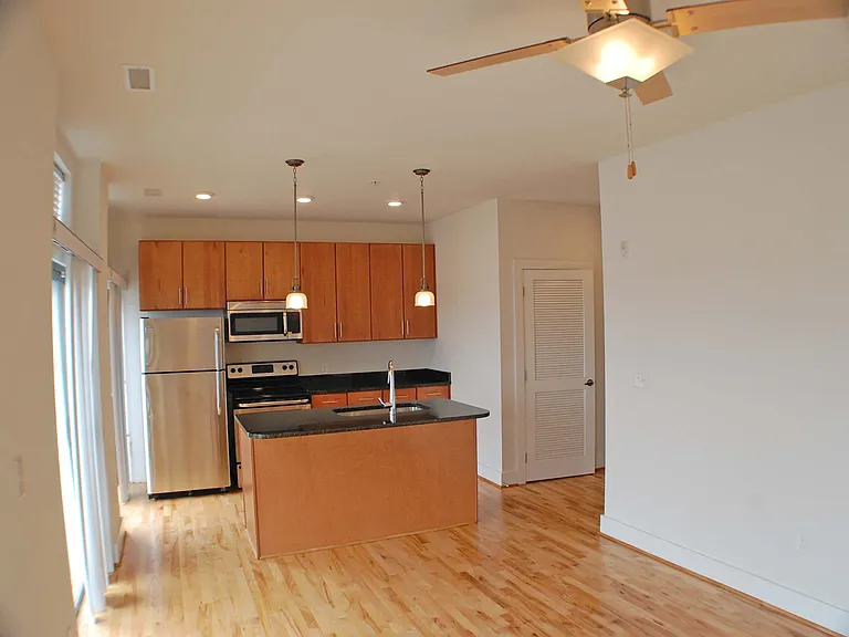 Each kitchen includes maple cabinetry, stainless steel appliances, granite countertops, icemaker, and sink disposal.