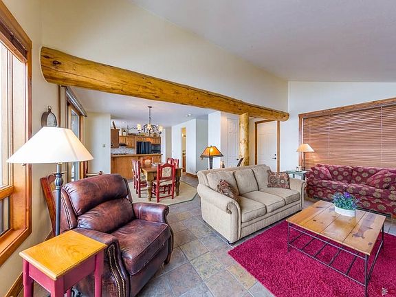 Open to the dining room with views of Mt Crested Butte. Features gas fireplace.