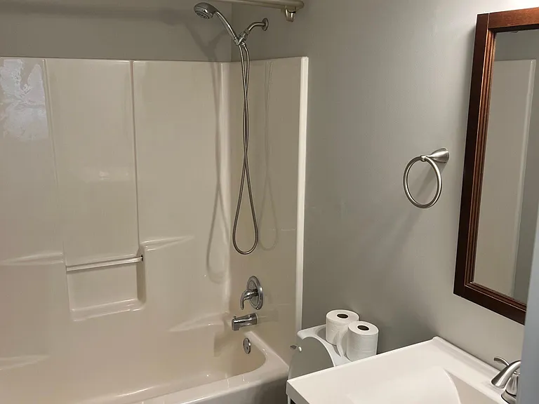 Main bathroom features tile flooring and new vanity cabinet.