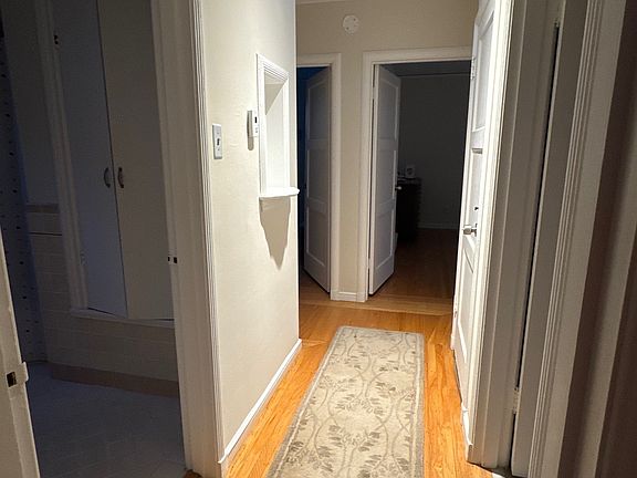 hallway from living room leads to two bedrooms