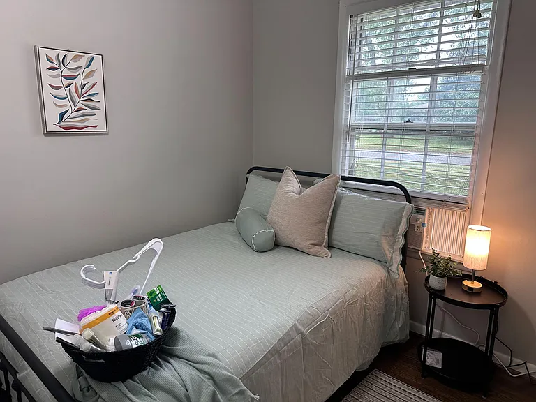 Modern room with memory foam bed, touch light, closet, and smart lock.