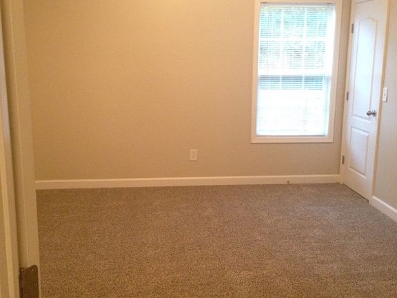 Master bedroom with trey ceiling and walk-in closet